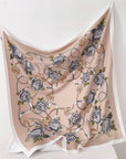 Floral and chain patterned scarf on a white background