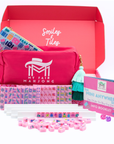My Fair Mahjong game set with pink box, tiles, and accessories on a white background