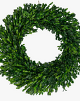 A preserved boxwood wreath with hanger, featuring meticulously preserved boxwood leaves in a circular shape, radiating a rich, vibrant green hue.
