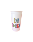 White cup with 'CHI OMEGA' printed in colorful letters on a white background