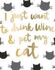 Napkin with text 'I just want to drink wine & pet my cat' in gold on a white background with black cat illustrations.