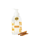 Bottle of 'Gingerbread' soap with two cinnamon sticks on a white background