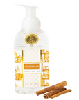 Bottle of 'Gingerbread' soap with two cinnamon sticks on a white background