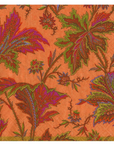 A square patterned napkin with a vibrant orange background and an intricate botanical design featuring leaves and flowers in green, purple, red, and brown.