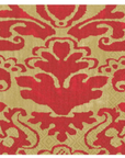 A close-up of a damask patterned napkin in red and gold, showing the woven texture and repeating ornate motif.
