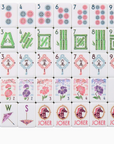 Set of colorful Mahjong tiles with various symbols on a white background