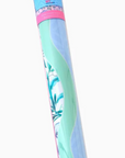 A rolled-up mahjong mat featuring pastel shades of mint green, light blue, and pink, wrapped in clear plastic with a pink and blue plasic tube