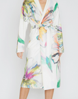 Woman wearing a colorful robe on a white background
