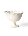 A white, ruffled trifle bowl with a footed base, suitable for serving desserts or as a decorative piece.