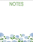Notepad with blue flowers and 'NOTES' text on a white background
