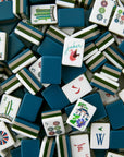 Collection of assorted mahjong tiles with various designs and colors.