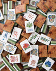 Collection of assorted mahjong tiles with various designs and symbols.