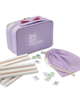 Purple travel-sized mahjong set with tiles and carrying pouch on a white background
