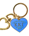 Gold and blue keychain with heart-shaped tag on a white background