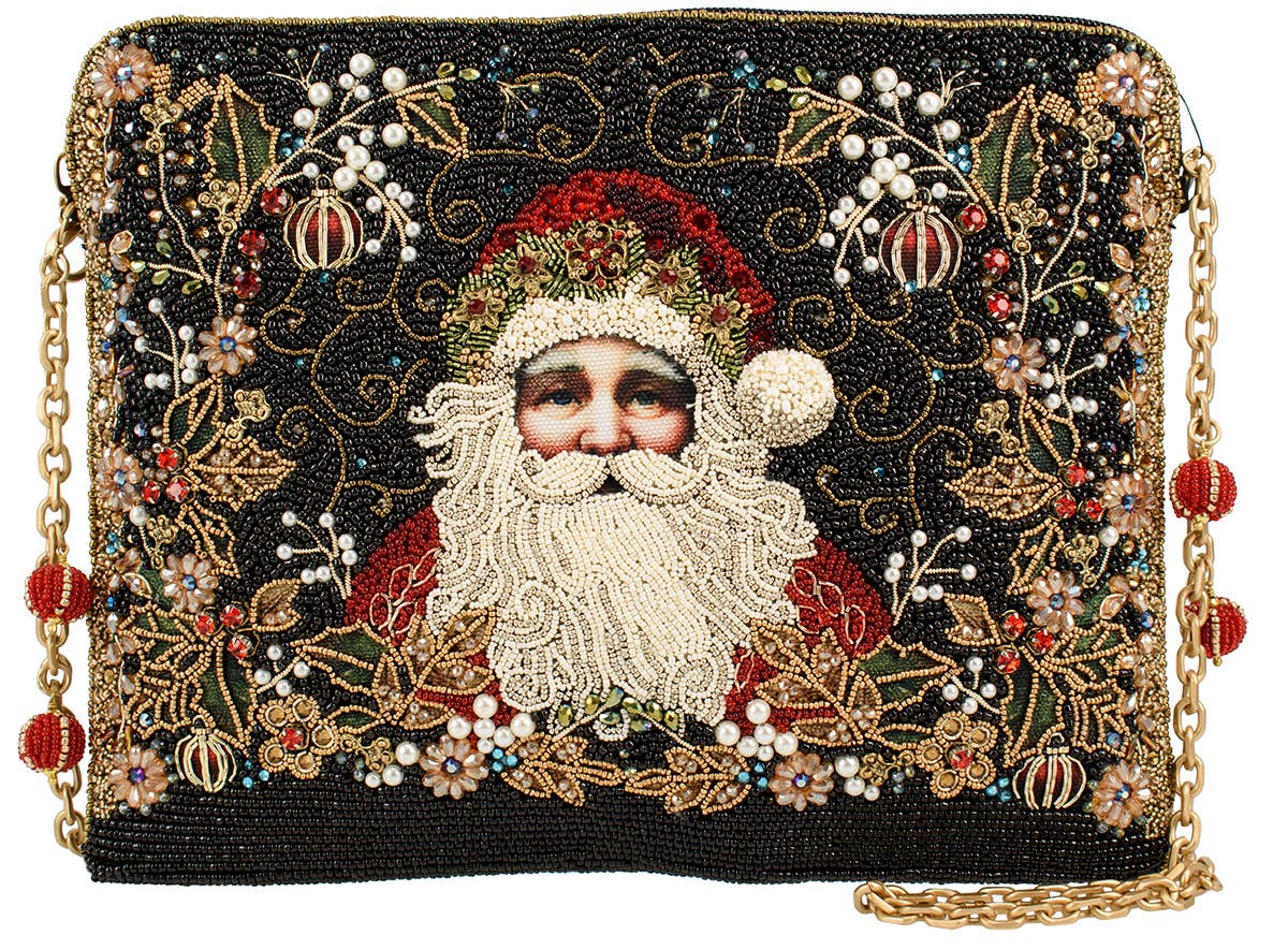 Decorative handbag with beaded design featuring a portrait of Santa in festive attire.