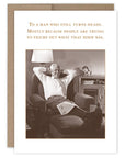 Greeting card with a man relaxing in a chair, text, and a sepia-toned photo.