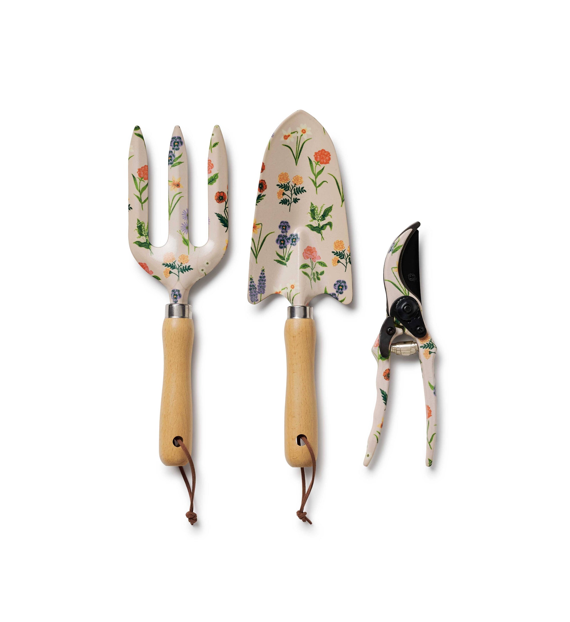 Set of three garden tools with floral handles on a white background