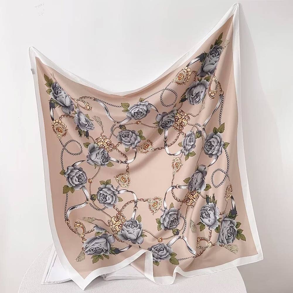 Floral and chain patterned scarf on a white background