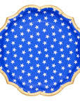 Blue paper plate with white star pattern on a white background