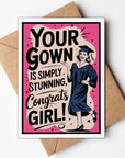 Graduation-themed card with a congratulatory message and a illustration of a graduate, placed on a brown envelope.