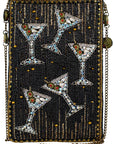 Beaded clutch with martini glass designs on a black background