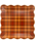 Plaid patterned paper plate on a white background