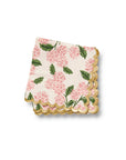 Floral-patterned napkin with scalloped edge on a white background