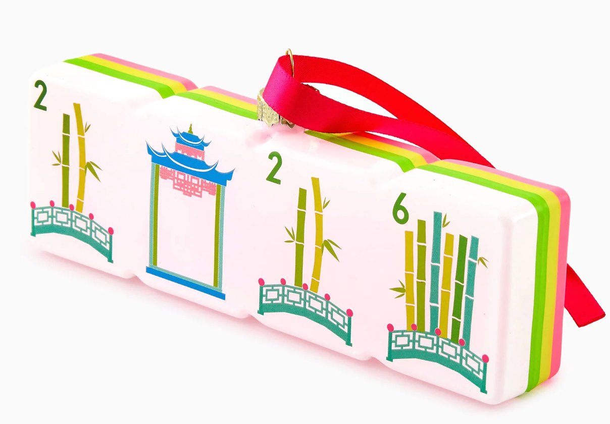 A set of three colorful Chinese mahjong tiles with a red carrying strap, featuring traditional illustrations of bamboo and a pagoda on a white background.