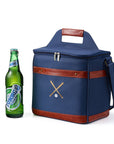 Blue cooler bag with brown leather accents next to a bottle of Peroni beer on a white background