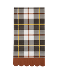 Plaid patterned napkin with scalloped edge on a white background