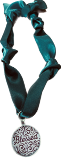 Teal scarf with a 'Blessed' pendant