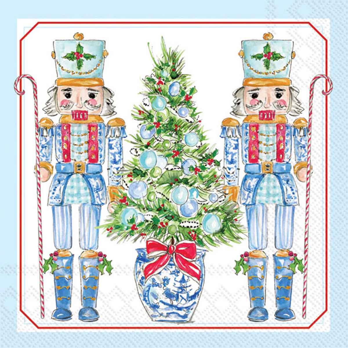 Cocktail napkins with nutcrackers and a Christmas tree on a light blue background
