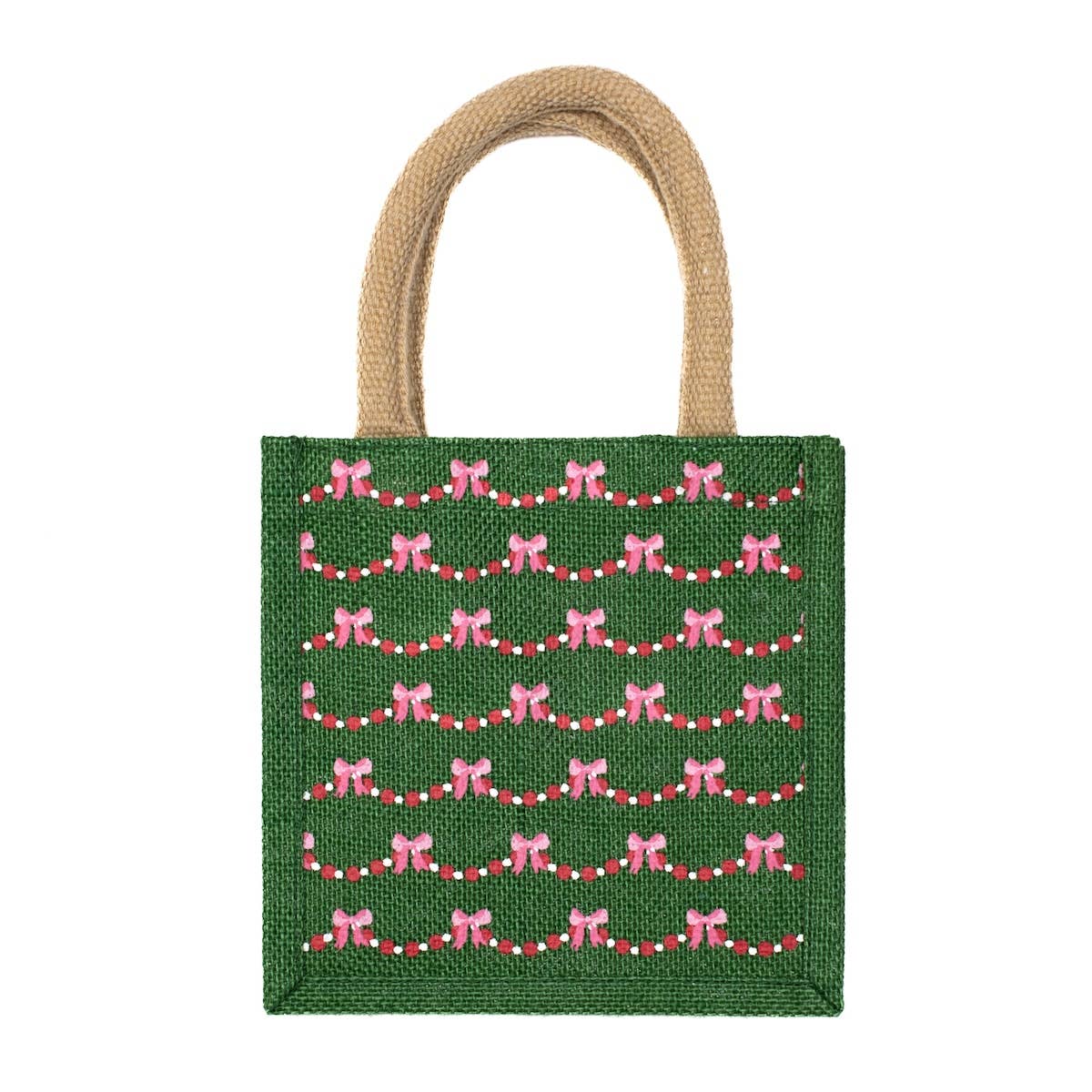 Green tote bag with pink bow and red string pattern on a white background
