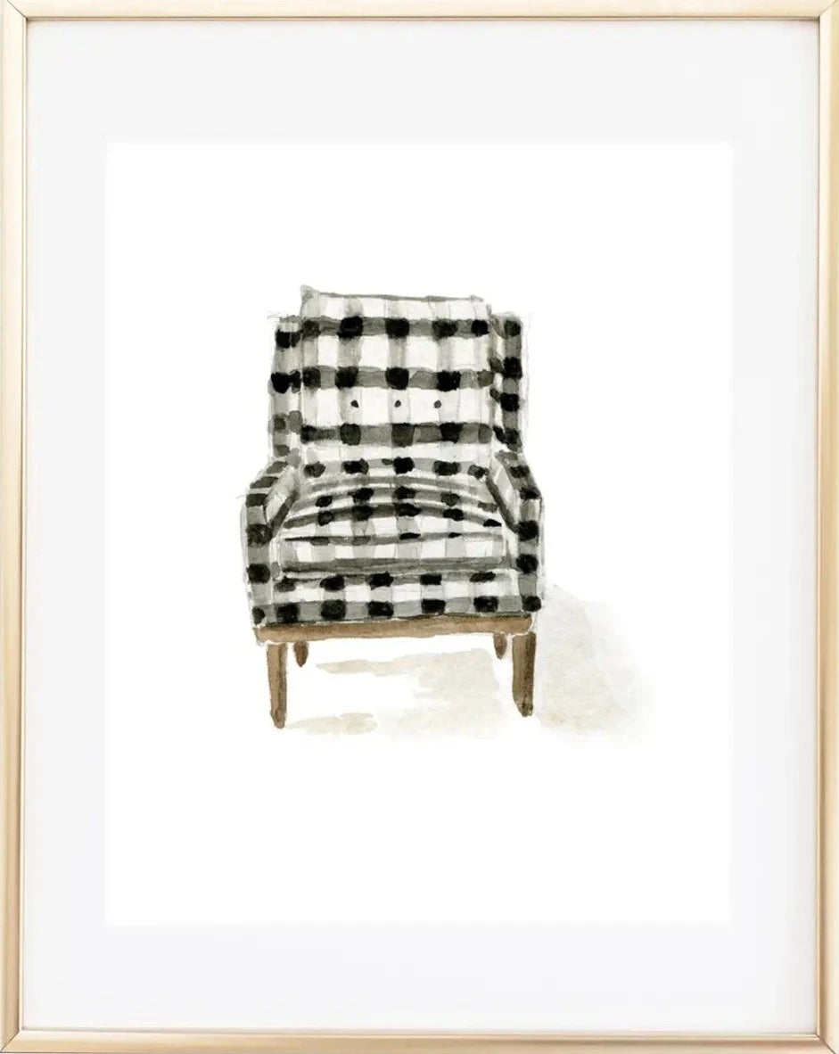 A framed art print of a chair with a plaid pattern, set against a white background.