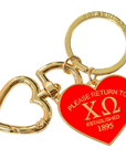 Keychain with red heart-shaped tag and gold heart charm on a white background