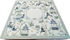 A mahjong mat featuring a classic Chinese toile pattern with blue and green illustrations on a white background, complete with a blank central square for text or photos.