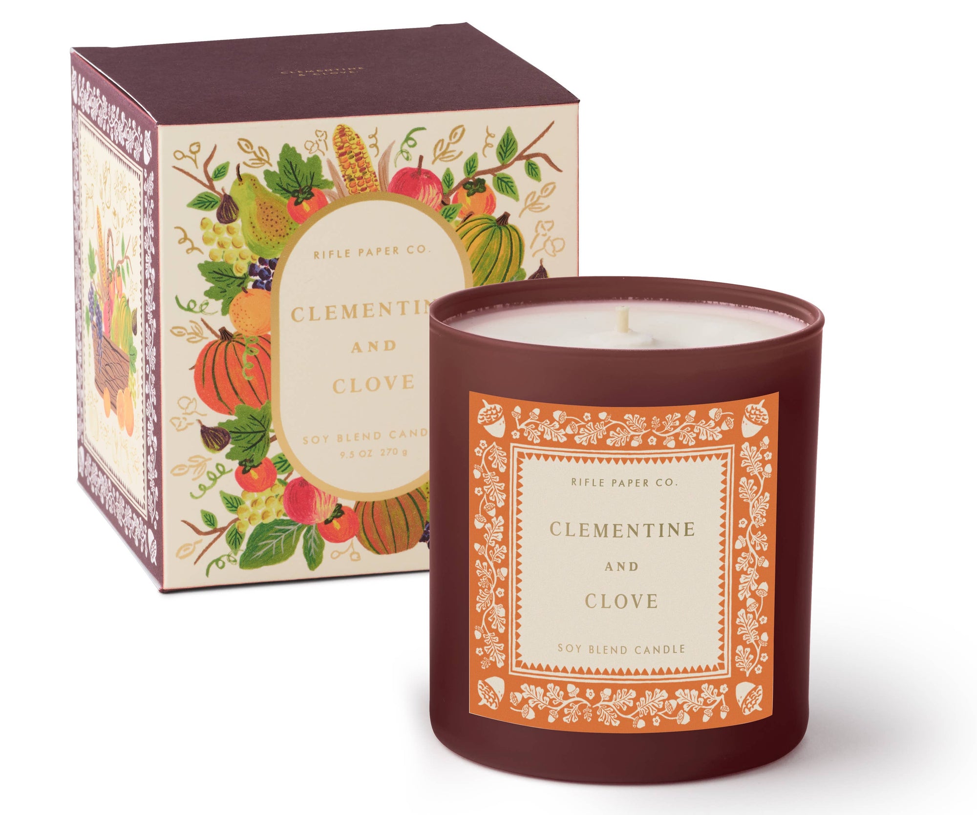 Clementine and Clove Glass Candle with decorative packaging on a white background
