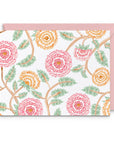 Floral patterned card with pink envelope on a white background