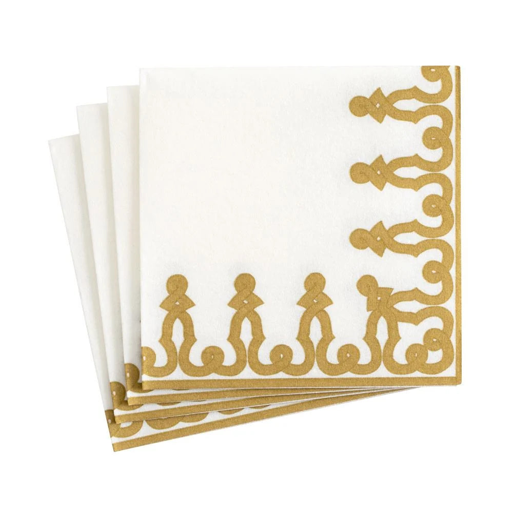 White napkins with gold decorative border on a white background