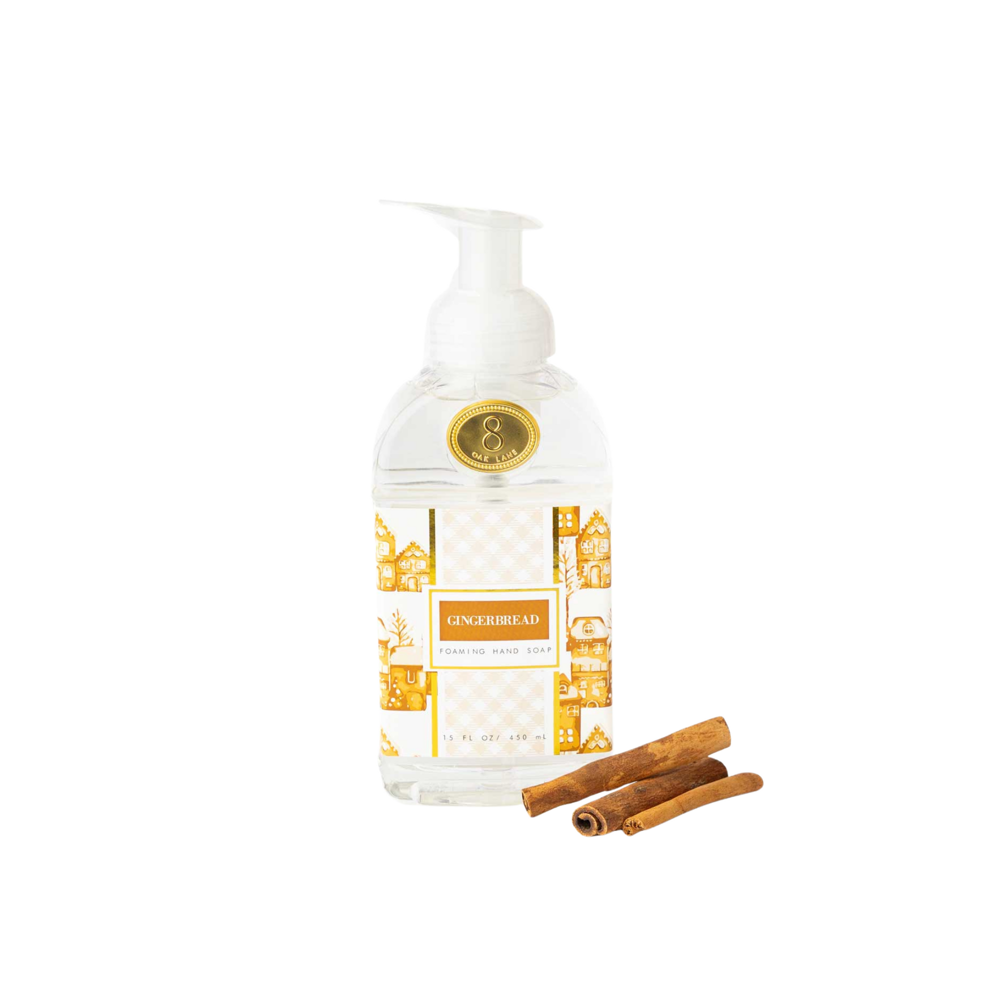 Bottle of 'Gingerbread' soap with two cinnamon sticks on a white background
