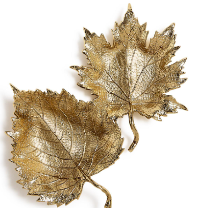Two metallic gold leaf-shaped decorative wall pieces with detailed vein patterns, shown on a plain white background.
