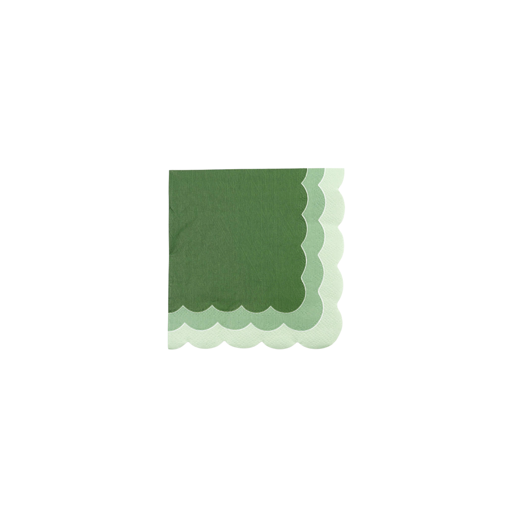 Green scalloped edge napkin on a white background