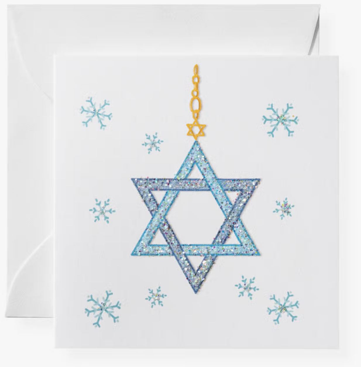 A folded card with a blue and multicolor design featuring a Star of David and snowflakes, sealed in a clear envelope.