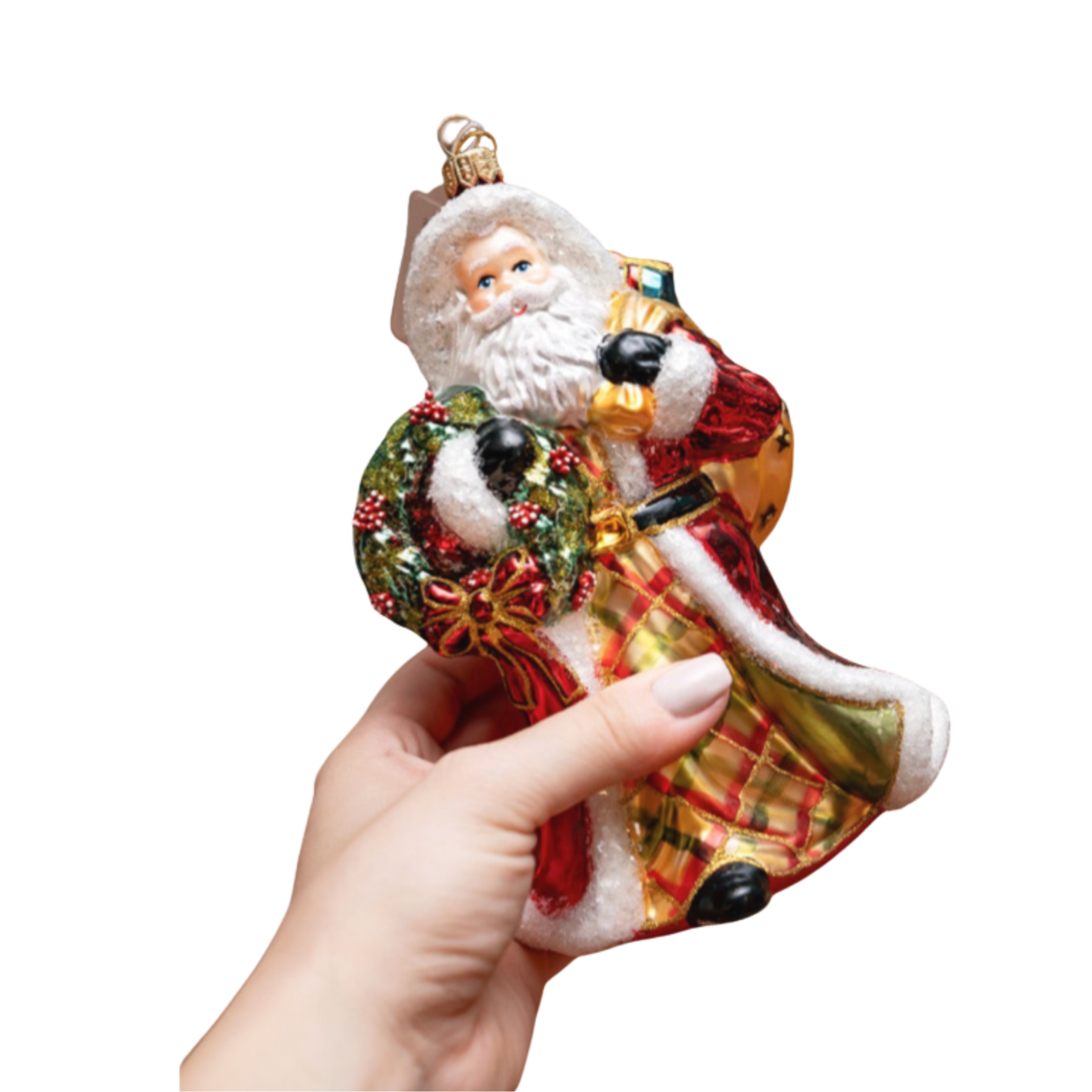 Hand holding a decorative Santa Claus ornament against a white background