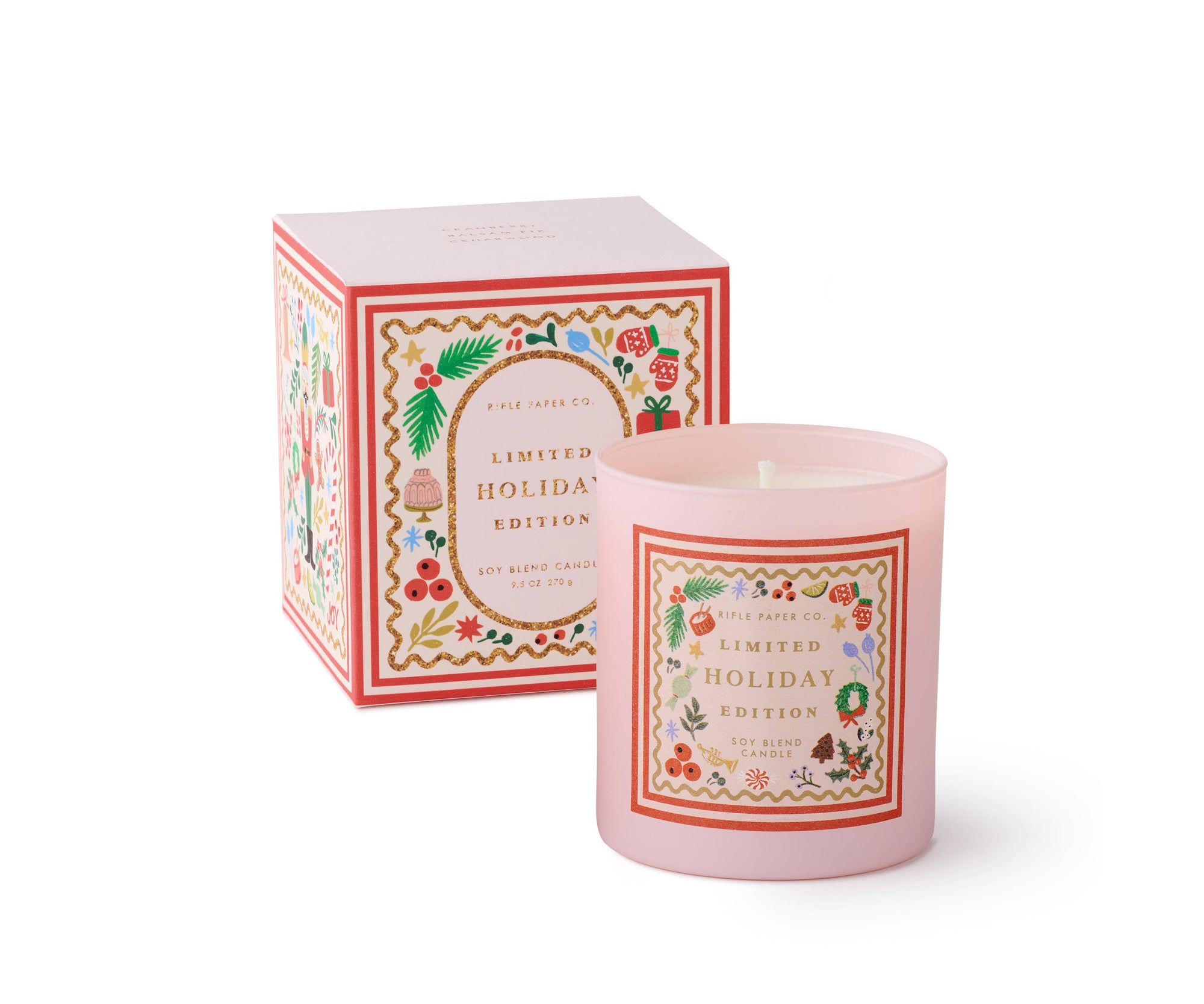 Pink candle with decorative label and matching box on a white background