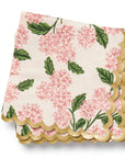 Floral-patterned napkin with scalloped edge on a white background