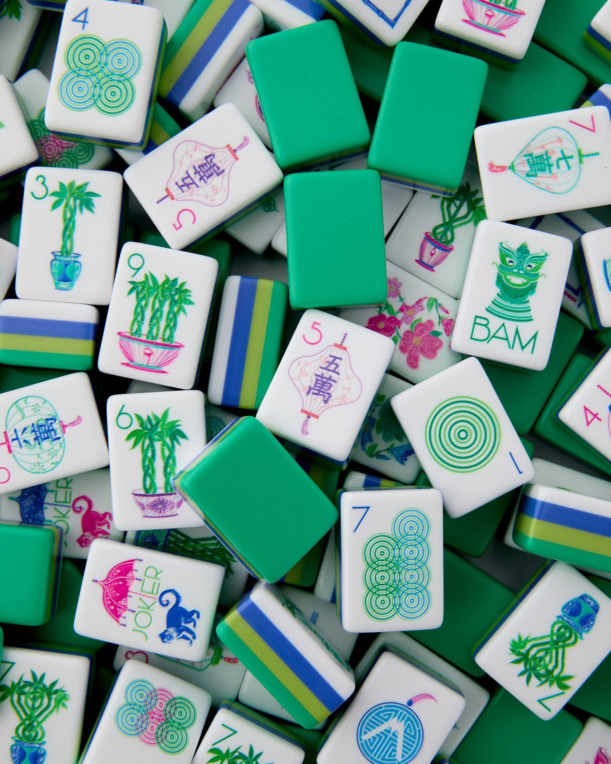 Collection of colorful Mahjong tiles with various designs.