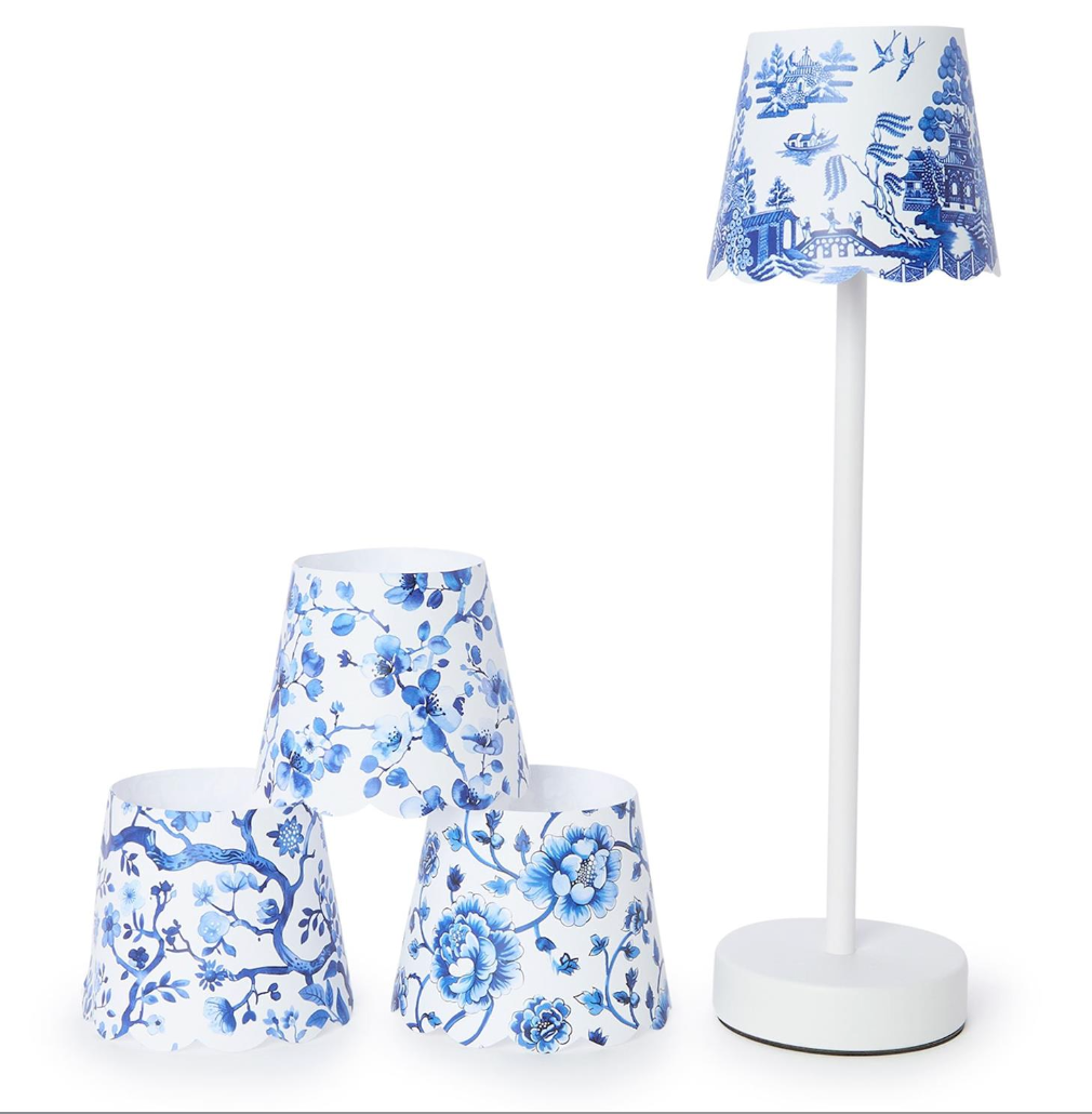 Set of blue and white floral-patterned lamps on a white background