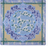 Mahjong mat with Decorative blue floral design on a beige background with green border