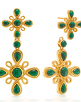 Gold earrings with green gemstones on a white background